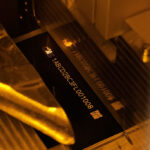 Laser marking UID information on laser markable paper labels